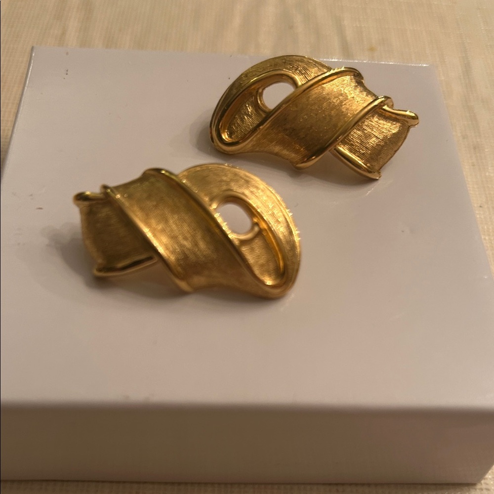 Givenchy ribbon style gold tone earrings pierced classic elegant sophisticated